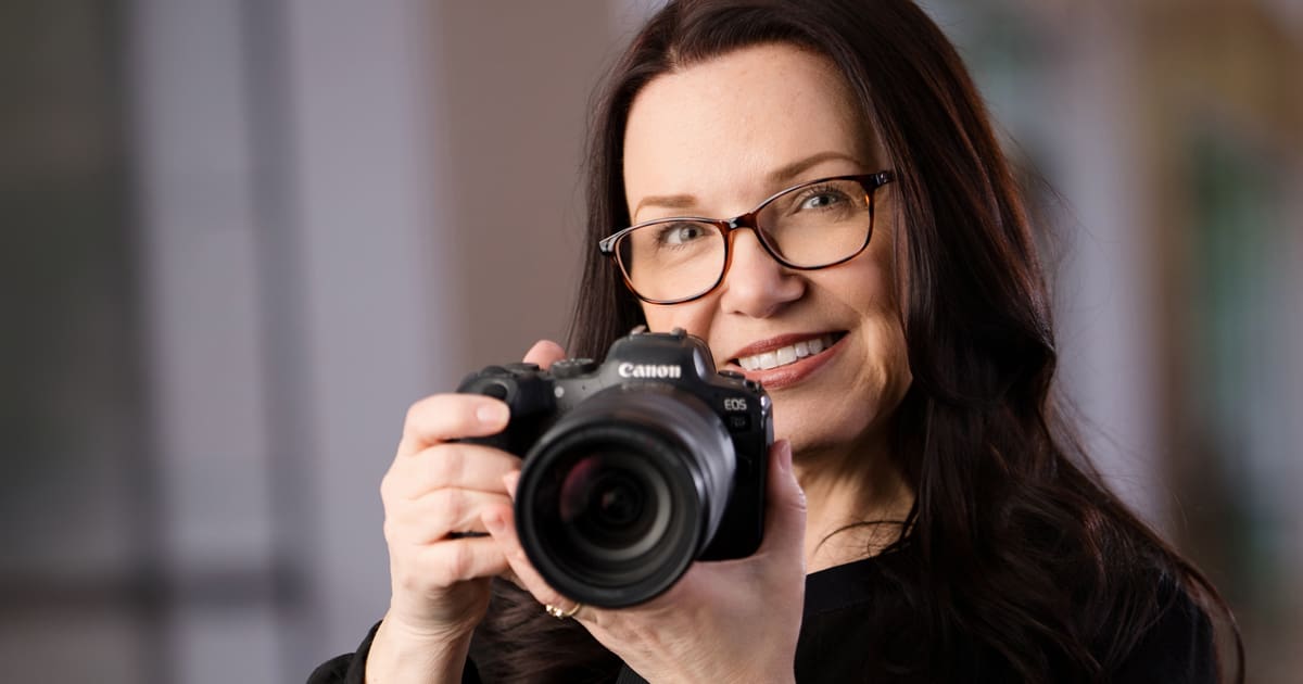 Photographer behind the camera in a corporate environment